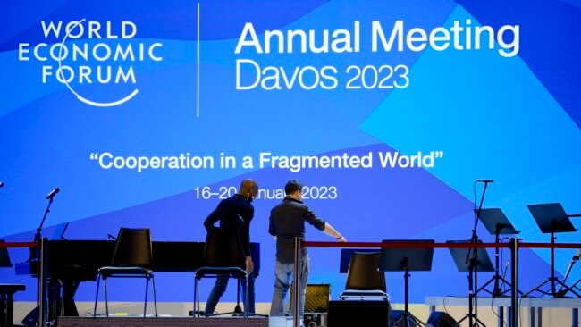 People set up the stage at the eve of the opening of the World Economic Forum in Davos, Switzerland, Jan. 15, 2023.