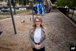 Natalie Rincon poses for a photograph outside a Houston elementary school Thursday, Nov. 17, 2022. (AP Photo/David J. Phillip)