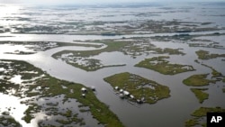 This aerial photo shows camps among fragmented marsh in Plaquemines Parish, Lousiana, on Nov. 3, 2021.