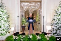 First lady Jill Biden speaks at an unveiling of this year's White House holiday theme and seasonal decor in the East Room at the White House in Washington, Nov. 28, 2022.