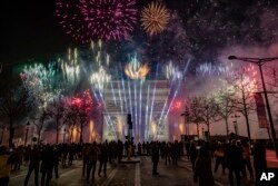 A sound and light show is projected on the Arc de Triomphe during New Year celebrations on the Champs Elysees in Paris, France, Jan. 1, 2023.