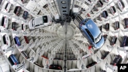 Volkswagen cars are presented to media inside a delivery tower prior to the company's annual press conference in Wolfburg, Germany, April 28, 2016.