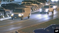 A white van, believed to be transporting Staff Sgt. Robert Bales, leaves Kansas City International Airport Friday, March 16, 2012, in Kansas City, Mo. 