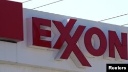 FILE - The Exxon Mobil logo is seen at a gas station in Denver, Colorado, United States.