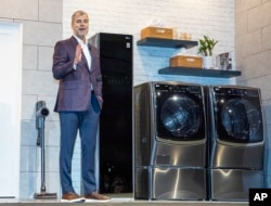 Dave VanderWaal of LG Electronics USA shows off ProActive Customer Care, an AI-powered customer service tool for home appliances during 2019 International CES in Las Vegas, Jan. 7, 2019.