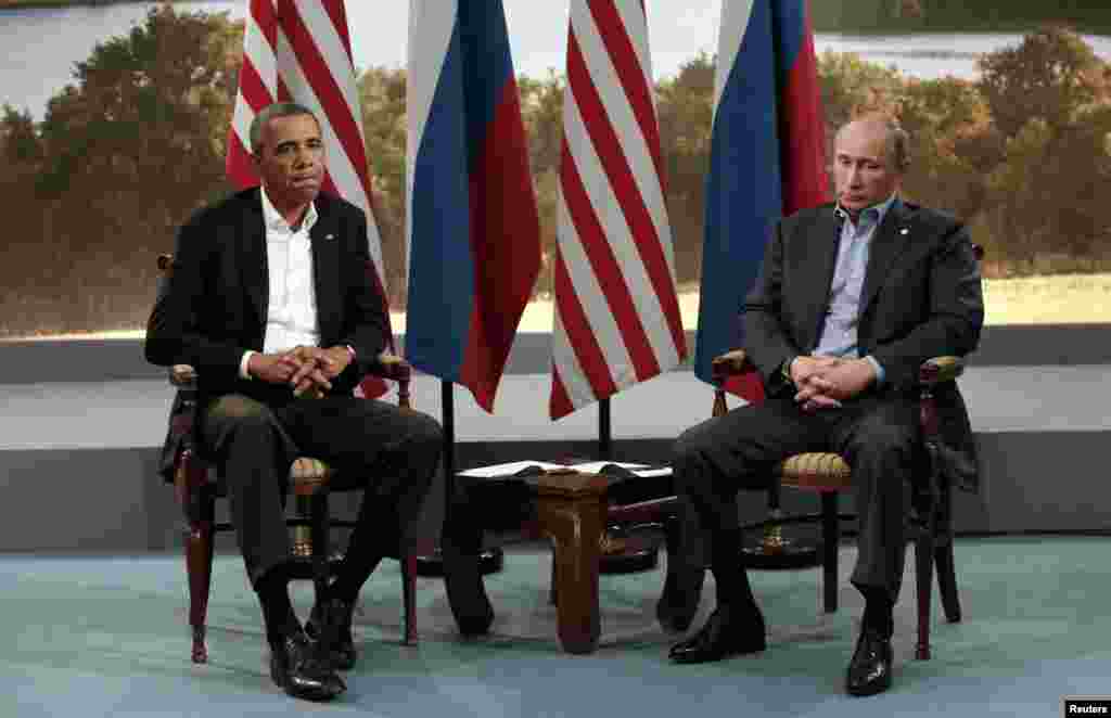 U.S. President Barack Obama (L) meets with Russian President Vladimir Putin during the G8 Summit at Lough Erne in Enniskillen, Northern Ireland, June 17, 2013. 