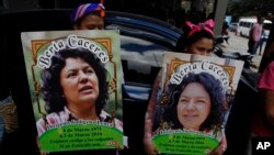 FILE - Family, friends and activists gather to demand justice for the murder of environmental activist and Goldman Environmental Prize winner Berta Caceres, in Tegucigalpa, Honduras, March 2, 2018.