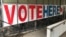 A 'Vote Here' sign marks the entrance on Sept. 20, 2018, to an early voting station in downtown Minneapolis.