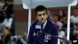 FILE - Chair umpire Carlos Ramos watches play as he officiates the match between Serena Williams and Naomi Osaka, of Japan, during the women's final of the U.S. Open tennis tournament, Saturday, Sept. 8, 2018, in New York. (AP Photo/Julio Cortez)