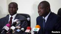 Mbacke Fall (R), head of the Extraordinary African Chambers, a special court set up this year by Senegalese authorities in agreement with the African Union, speaks to journalists at a news conference in Dakar, July 1, 2013.
