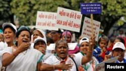 Supporters of India's main opposition Congress party shout slogans during a protest against the alleged rape and killing of a 27-year-old woman, in Ahmedabad, India, Dec. 5, 2019. 