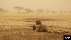 FILE - A French soldier secures a perimeter in Mali, March 26, 2019.