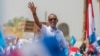 Rwandan President Paul Kagame of the ruling Rwandan Patriotic Front (RPF) waves to his supporters during his final campaign rally in Kigali, Rwanda, Aug. 2, 2017.