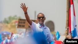 Rwandan President Paul Kagame of the ruling Rwandan Patriotic Front (RPF) waves to his supporters during his final campaign rally in Kigali, Rwanda, Aug. 2, 2017.