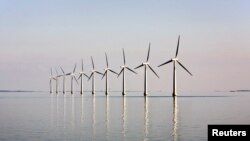 FILE - An off-shore wind farm stands in the water near the Danish island of Samso, May 19, 2008.