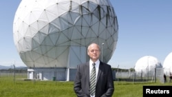 FILE - President of the German Federal Intelligence Agency (BND) Gerhard Schindler stands at the former monitoring base of the National Security Agency (NSA) in Bad Aibling, south of Munich, June 6, 2014. Gerhard Schindler is stepping down two years early and is replaced by Finance Ministry official Bruno Kahl.