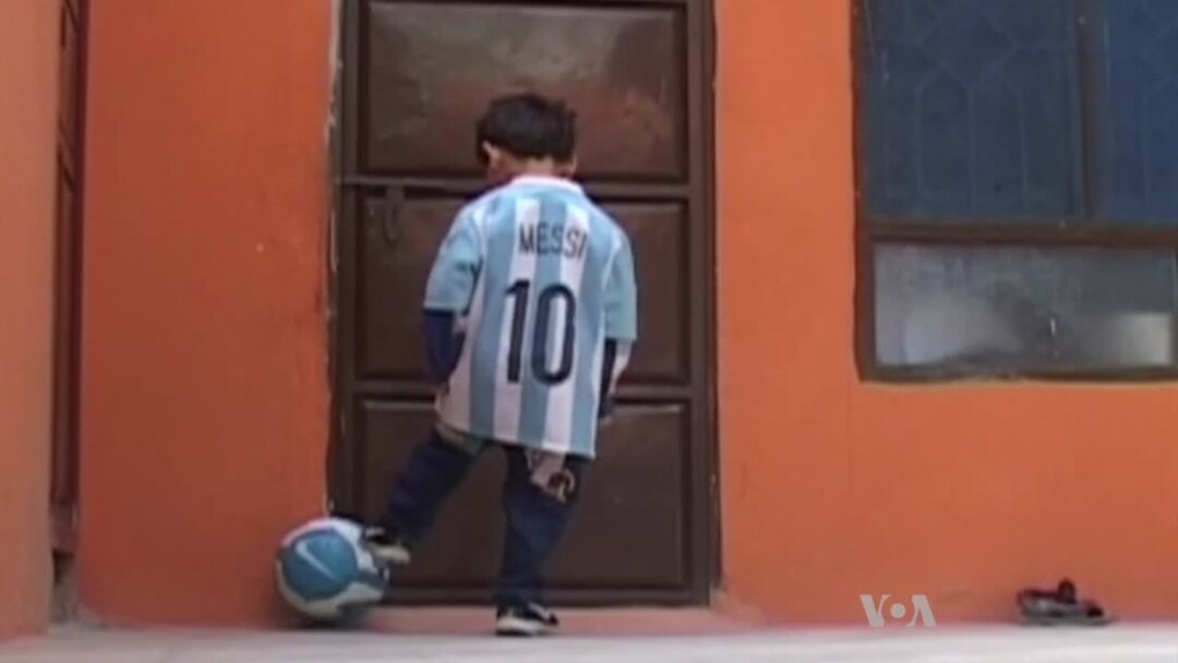 5-year-old Afghan soccer fan with makeshift Lionel Messi jersey