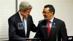 U.S. Secretary of State John Kerry, left, and Ethiopian Foreign Foreign Minister Tedros Adhanom shakes hands during a joint press conference in Addis Ababa, Ethiopia, Saturday, May 25, 2013. Making his first official trip to sub-Saharan Africa, U.S. Secre