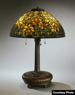 The "Daffodil" lampshade the Neustadts purchased from a second-hand shop in Greenwich Village, New York, for $12.50 is now worth between $50,000 and $75,000. (Courtesy of The Neustadt Collection of Tiffany Glass)