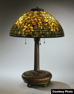 The "Daffodil" lampshade the Neustadts purchased from a second-hand shop in Greenwich Village, New York, for $12.50 is now worth between $50,000 and $75,000. (Courtesy of The Neustadt Collection of Tiffany Glass)