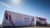 The COP27 U.N. Climate Summit logo and the Egyptian flag are displayed on a billboard lining a newly constructed highway in Sharm el-Sheikh, Egypt, Nov. 5, 2022.