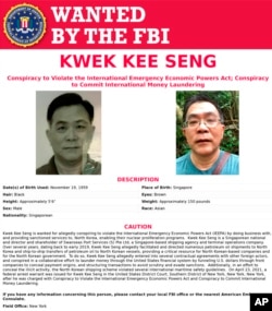 This image released by the FBI shows the wanted poster for Kwek Kee Seng.