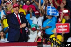 Former President Donald Trump reacts to the crowd after he finished speaking at a campaign rally in support of the campaign of Sen. Marco Rubio, R-Fla., at the Miami-Dade County Fair and Exposition, in Miami, Nov. 6, 2022.