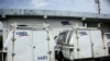 ARCHIVO - Camiones de la empresa nacional de telecomunicaciones de Venezuela, CANTV, en una de sus instalaciones en Barinas, Venezuela, en septiembre de 2018. 