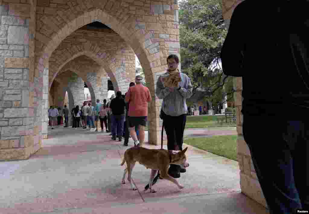Nali and her owner Nick Edinger line up at Austin Oaks Church during the U.S. midterm elections in Austin, Texas, Nov. 8, 2022.