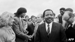 FILE: In this Jun. 20, 1983 photo, President of Cameroon Paul Biya (C) welcomed his French counterpart François Mitterrand (R), French tennisman Yannick Noah (2-L) and Marie-Claire Noah (L) at Yaounde airport.