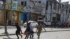 FILE - An injured civilian is evacuated from the scene of an explosion in Mogadishu, Somalia, Oct. 29, 2022. Al-Shabab claimed responsibility for the attack, as well as a Saturday suicide bombing targeting a military training facility in Mogadishu.