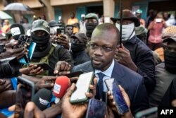 FILE - Ousmane Sonko, president of the opposition party Senegalese Patriots for Work, Ethics and Brotherhood (PASTEF), gives a press statement, in Ziguinchor, Senegal, July 3, 2022.