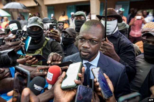 FILE - Ousmane Sonko, president of the opposition party Senegalese Patriots for Work, Ethics and Brotherhood (PASTEF), gives a press statement, in Ziguinchor, Senegal, July 3, 2022.