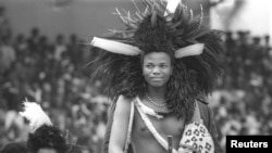FILE- Prince Makhosetive wears a feather headdress during his coronation ceremony to become King Mswati III of Swaziland. Prince Makhosetive wears a feather headdress during his coronation ceremony to become King Mswati III of Swaziland, April 26, 1986.