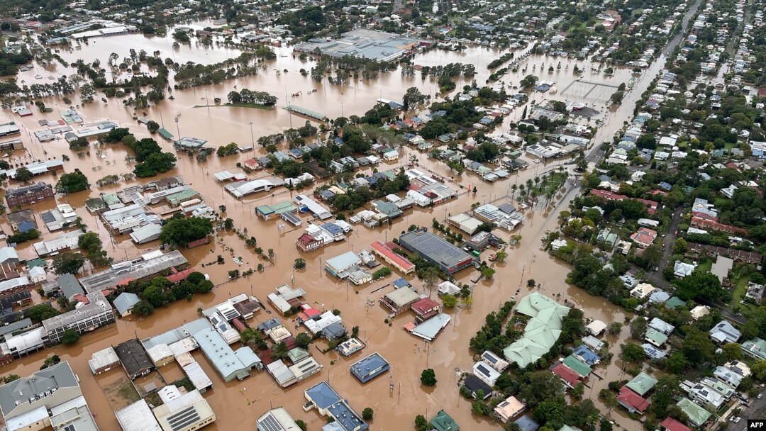 FILE - A handout from the New South Wales State Emergency Service shows floodwaters inundating the city of Lismore, March 31, 2022.