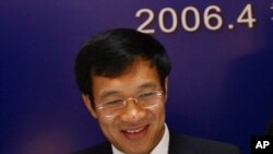 FILE - Then China Construction Bank Corp Vice President Fan Yifei attends a press conference in Hong Kong on April 6, 2006.