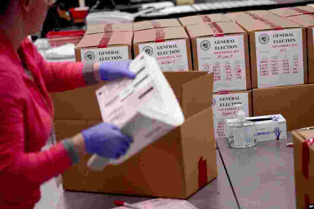 An election worker boxes counted ballots inside the Maricopa County Recorders Office in Phoenix, Arizona.