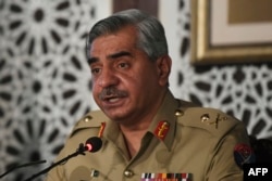 FILE - Lieutenant General Babar Iftikhar, military spokesman of Inter-Services Public Relations (ISPR), speaks during a press conference in Islamabad, Nov. 14, 2020.