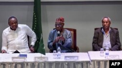 Former Nigeria President, Olusegun Obasanjo (C) gives an address alongside former Kenya President Uhuru Kenyatta and Tadesse Worede from the Tigray People's Liberation Front (TPLF), at the start of a meeting in Nairobi, Nov. 7, 2022.