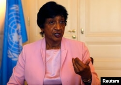 FILE - Then-outgoing U.N. Human Rights Commissioner Navi Pillay talks during an interview to Reuters in her office in Geneva, Aug. 19, 2014.
