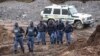 South African police investigate at the scene where more 21 bodies of suspected illegal miners were found near an active mine in Krugersdorp, South Africa, Nov. 3, 2022.