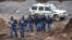 South African police investigate at the scene where more 21 bodies of suspected illegal miners were found near an active mine in Krugersdorp, South Africa, Nov. 3, 2022.