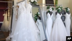 FILE: Wedding dresses are displayed at a bridal shop on Feb. 28, 2020. 