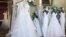 FILE: Wedding dresses are displayed at a bridal shop on Feb. 28, 2020. 