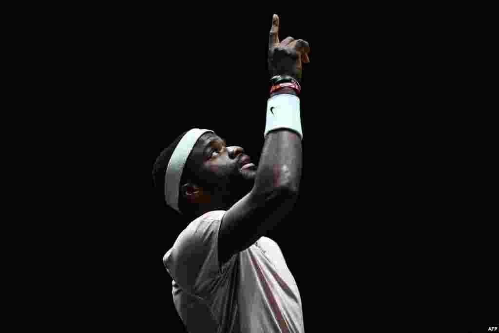 U.S.'s Frances Tiafoe gestures as he arrives on the court to play against Canada's Felix Auger-Aliassime for their men's singles quarter-final tennis match at the ATP World Tour Masters 1000 in Paris.