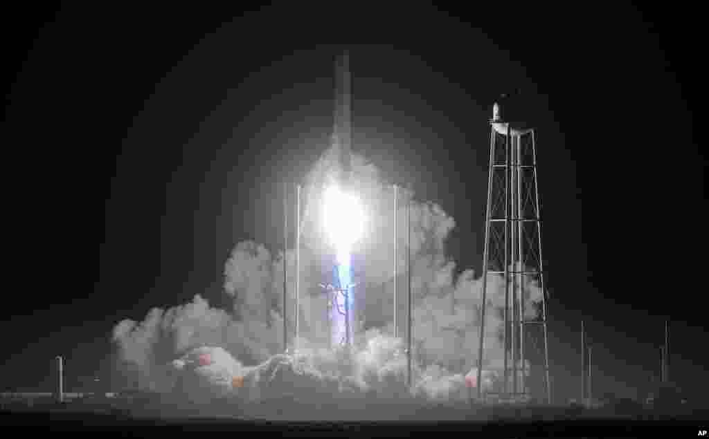 Northrup Grumman&#39;s Antares rocket lifts off the launch pad at the NASA Wallops Flight Facility in Wallops Island, Virginia, to deliver a supply capsule to the International Space Station.