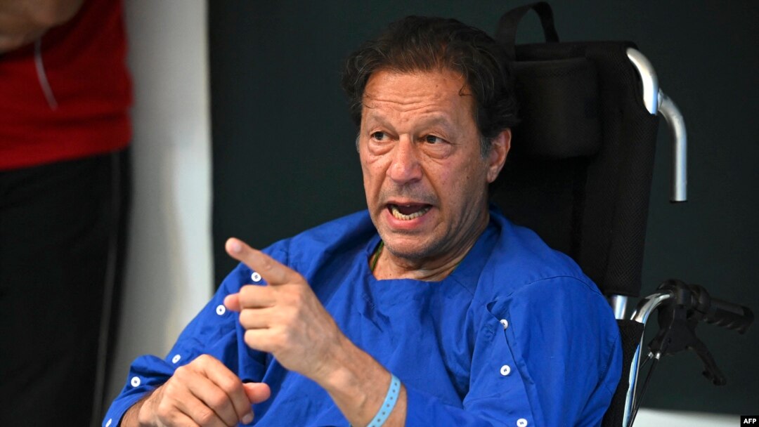 FILE - Pakistan's former prime minister Imran Khan addresses the media representatives at a hospital in Lahore, Nov. 4, 2022, a day after an assassination attempt on him.