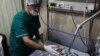 Doctors treat a child wounded after Syrian government forces shelled tent settlements housing families displaced by the country's conflict, Nov. 6, 2022.