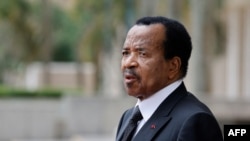 FILE — Cameroon's President Paul Biya pictured outside the Presidential Palace in Yaounde, July 26, 2022.