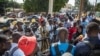 People gather outside the Thies, Senegal, courthouse on Thursday, when a judge dismissed a lawsuit by a fishermen’s collective against a fishmeal factory they accused of polluting their village and destroying their livelihoods.
